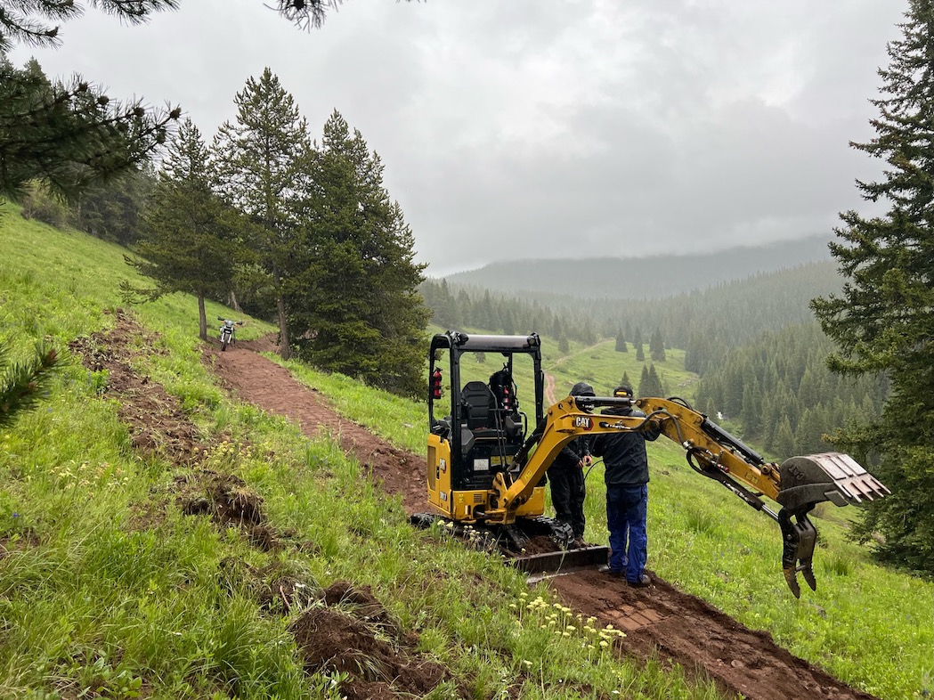 Vail Resort, Vail Colorado, Mill Creek Trail, working on maintenance of the machine.